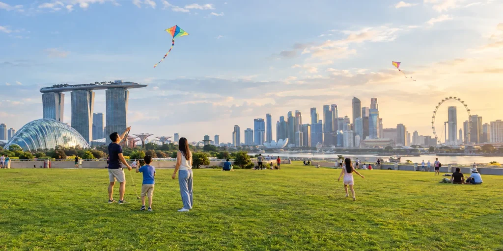 Family flying kites on the Green Roof at Marina Barrage Singapore