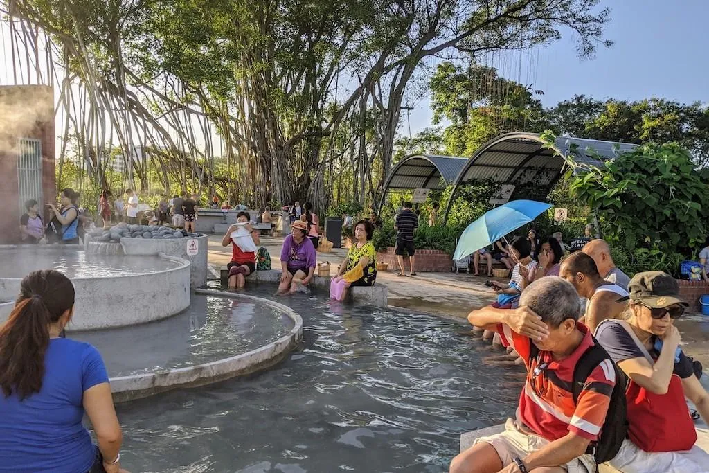 Visitors soaking their feet at Sembawang Hot Spring Park in Singapore