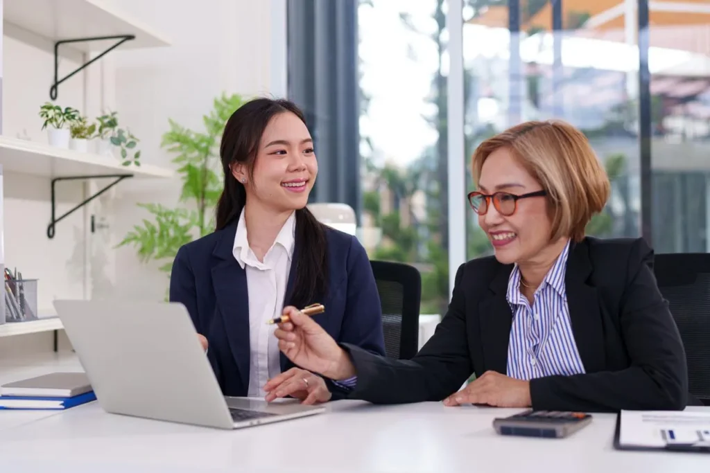Mature employee discussing re-employment arrangements with a manager in Singapore